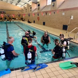 padi open water divers enjoying their first pool session at stellar divers